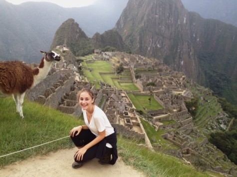 Senior Eleonor Bauwens smiles with a llama in Peru.
