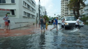 Pedestrians have to walk through shin deep waters to simply cross a street.