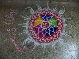 Beautiful flowers are drawn with colorful sand on doorsteps.