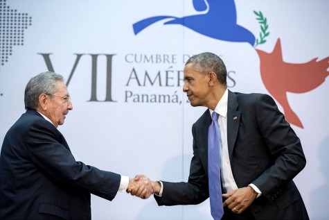President Obama shakes hands as he speaks with President Castro about making amends 