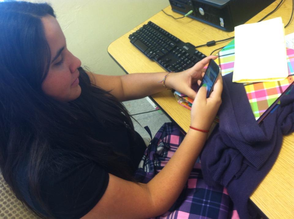 Student Paola Carpio checking her Instagram on her free time.