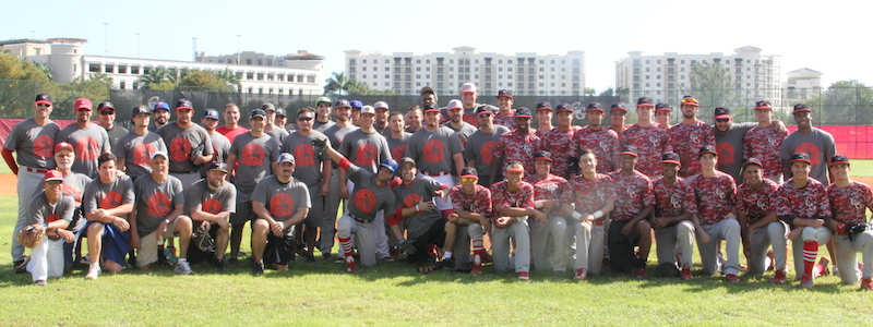 Alumni and current baseball players stand together to add to the memories of their home.
