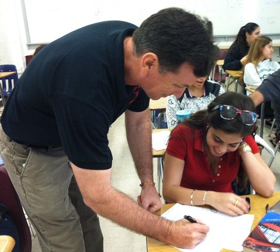 Mr.Weiner assisting student Lilian Morales on her assignment.