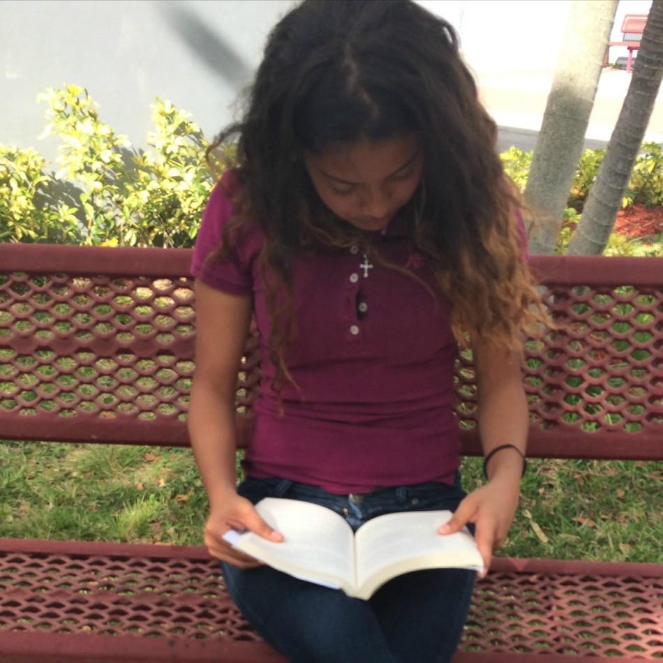 Freshman Ana Urueta is in love with Thirteen Reasons Why by Ray Asher.