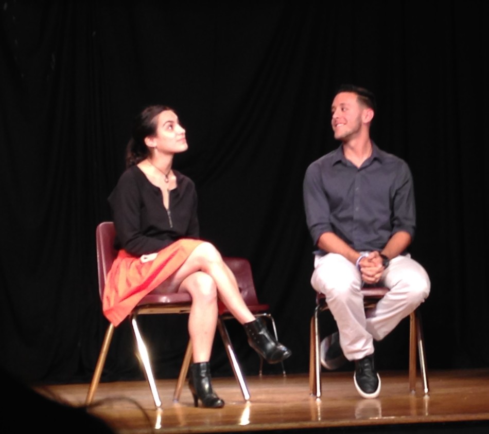 Two members of the Improv Troupe perform a skit that goes along with the acting game 'Fortunately, Unfortunately.'