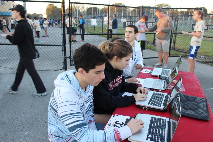 Student activities helping give the runners their numbers