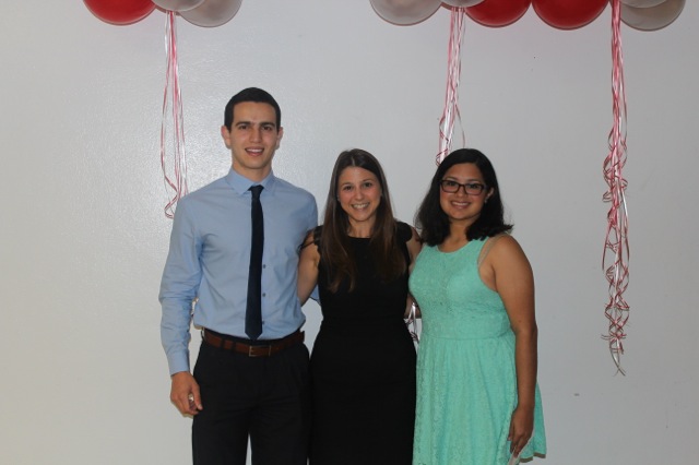 Two of the scholarship winners, along with Mary Snow share their happiness with a big smile on their faces.