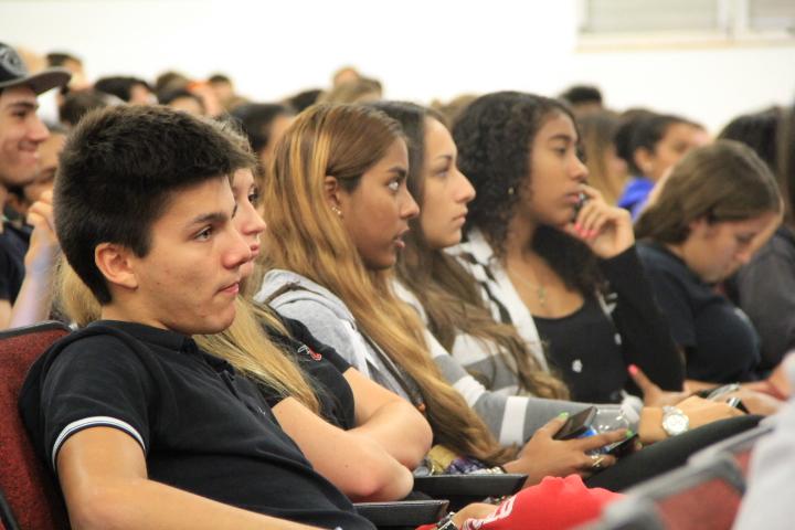 Students attentively listen to speaker, Mrs. Suarez.