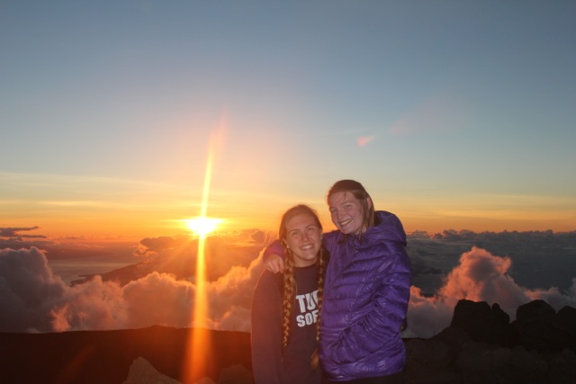 Claire and Camila at the top of the Haleakala Crater at sunset in Maui. The crater is the largest dormant volcano in the world at over 10092 feet. 