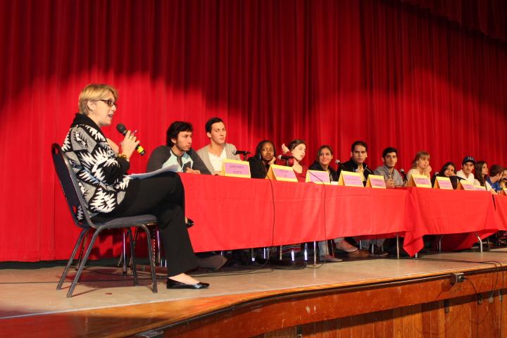 CAP adviser Mrs. Stack leads an assembly where Gables alumni share their college experiences.