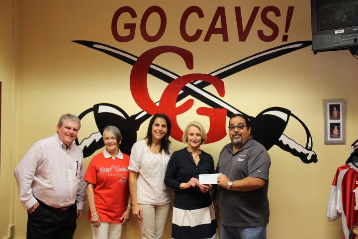 The class of '64 gives Mr. Costa a check for $3,900.