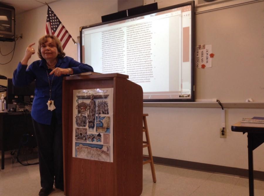 Ms. Verazain using the Promethean board to give a lecture. 