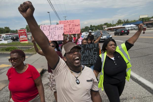 Protestors march in Ferguson, Missouri in response to the death of teen Michael Brown.