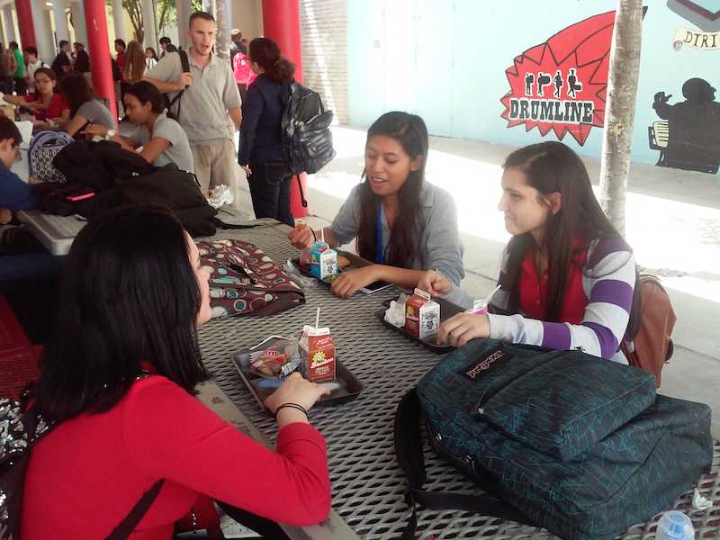 A group of juniors grabbing a bite in the pavilion.