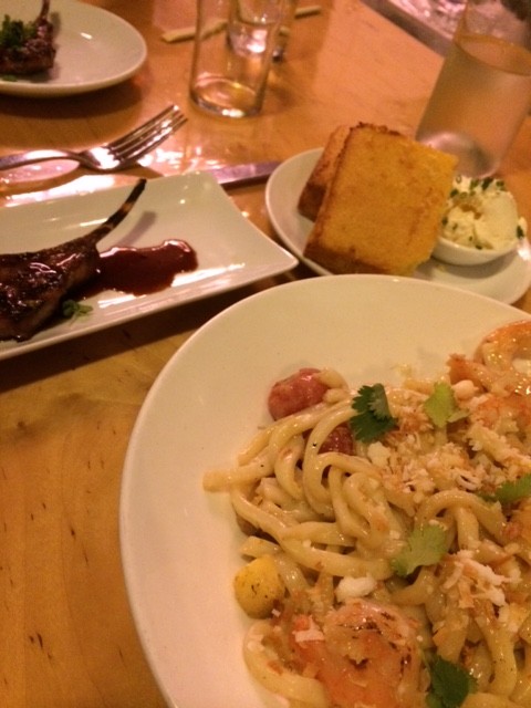 Gigi offers a diverse menu, such as lamb lollipops, cornbread with honey bacon butter, and shrimp udon, pictured above.