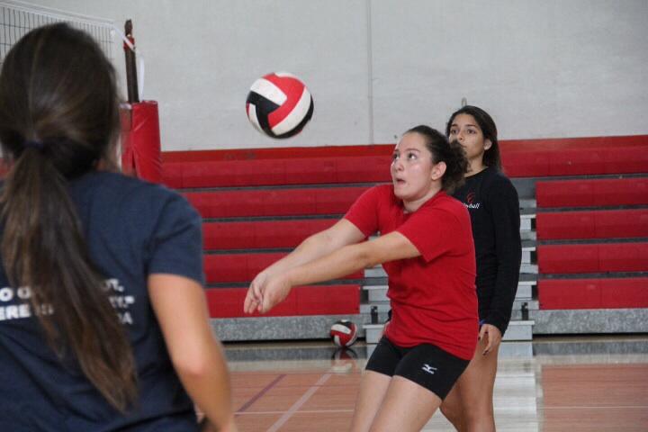 Yara Faour practicing with her fellow varsity volleyball teammates.