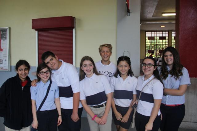 Tour Guide and Sophomore Class President Holden Payne stands with a group of visiting 8th graders as he prepares to give them a tour of Gables.