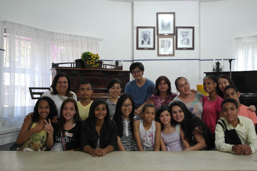 Sunny Na (front row, fourth from left) sits with the children she helped in teaching the musical, Mamma Mia!.