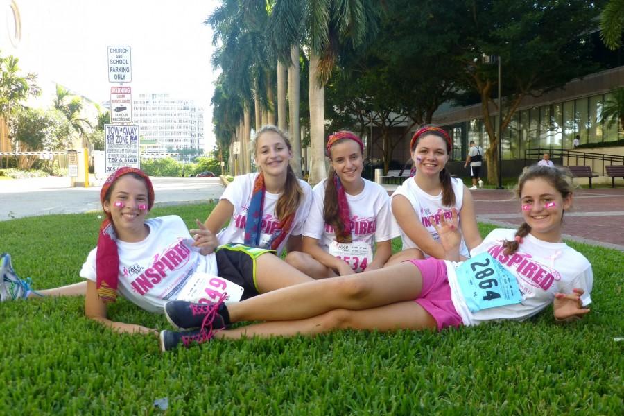 Junior Eleonor Bauwens (back left) participated in Susan G. Komens Race for a Cure last year and plans on going every year.