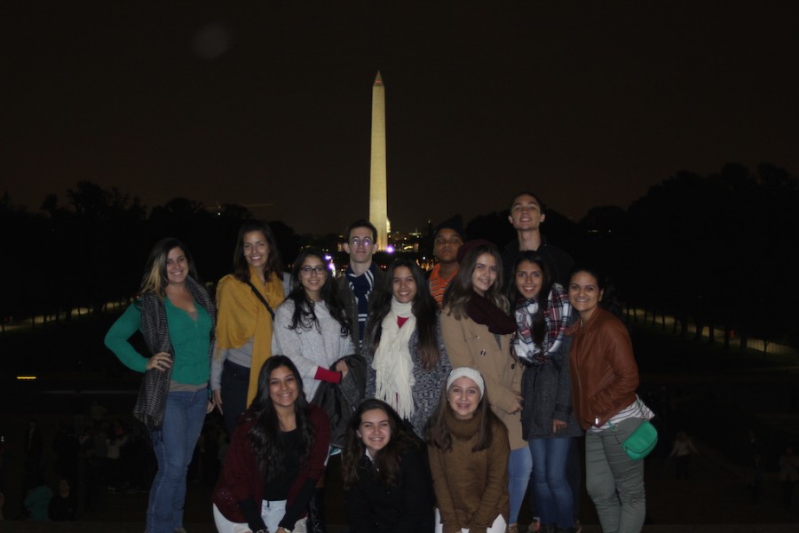 Students from four out of five CAFDM publications stand near the Washington Monument with Ms. Zaldivar and Mrs. Gonzalez.