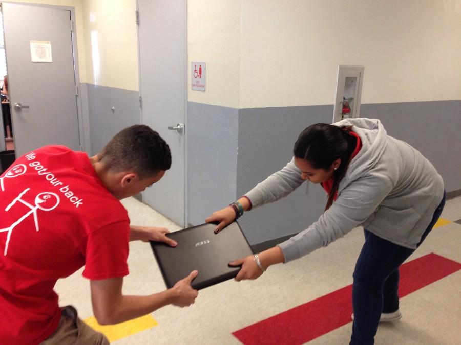 Two eager Black Friday shoppers fighting over the store's last computer.