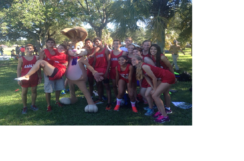 The XC team posses with one of the mascots at the regionals meet.