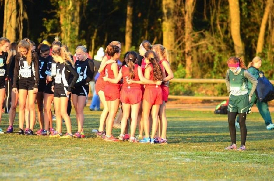 Girls cross country top-seven huddles prior to the state final race in Tallahassee on Saturday, Nov. 15.