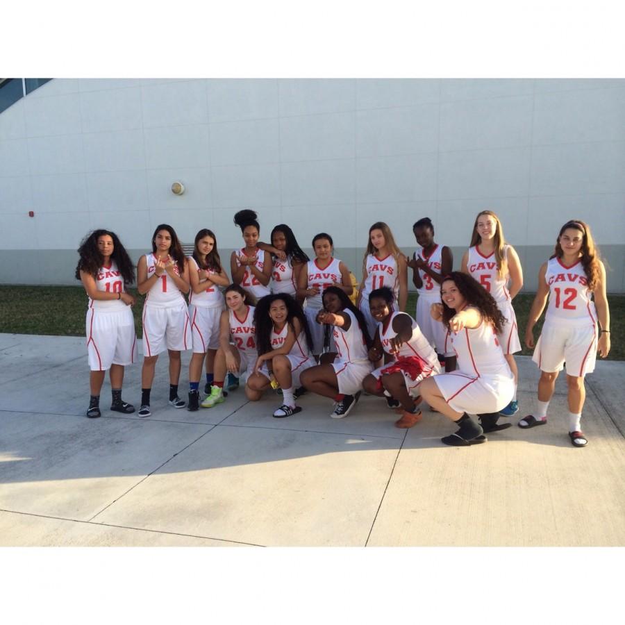 Members of the girls basketball team in their new uniforms. 