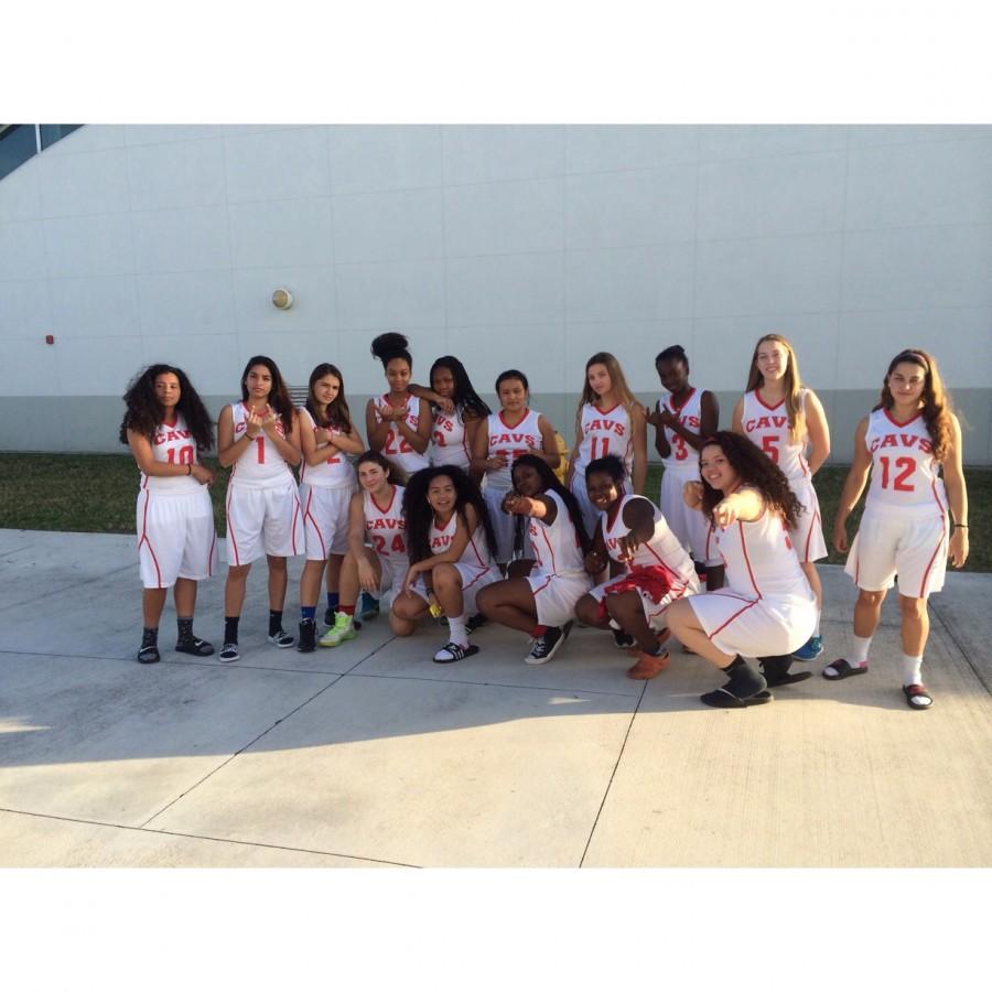 Members of the girls basketball team in their new uniforms. 