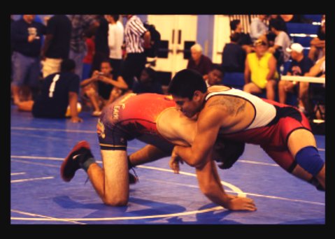 Joshua Zambrano wrestles his opponent in the South Dade match.