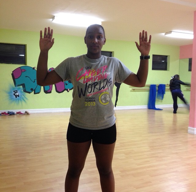 Amber Williams shows her support for Michael Brown by doing the iconic Hands Up Don't Shoot pose.