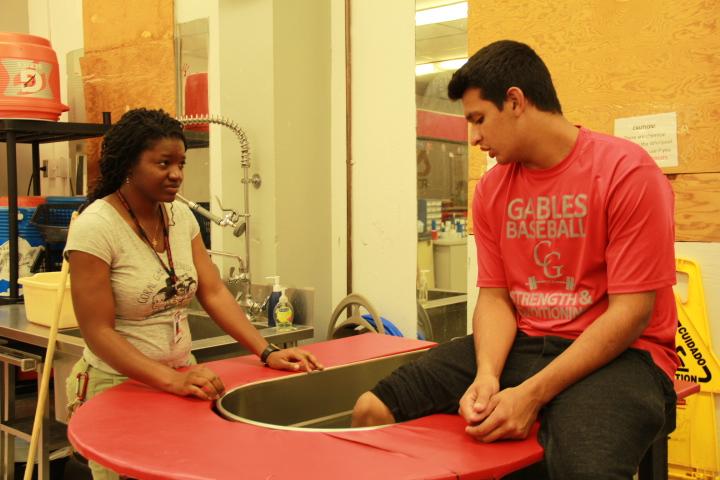 Ms.Singleton helping out a student in the whirlpool