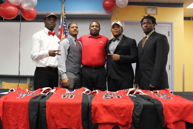 Shaquery Wilson, Jontavis Testa, Jared Mcgahee, Emilio Gibbs and Coach Pollard together at the signing. 