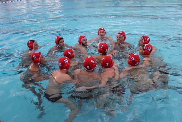 The boys Water polo team huddled before the game.