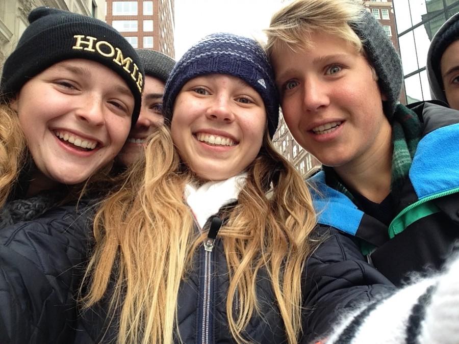 Juniors Jordan Payne and Gabi Saliamonas snap a selfie with sophomore Holden Payne as they walk the streets of Boston.