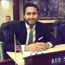 Director of Government Affairs, Tapia, smiles for his profile.