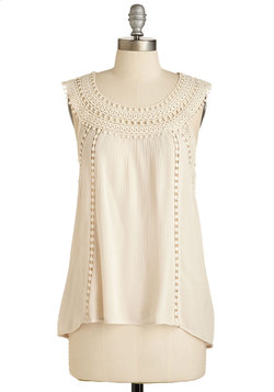 To enhance that gorgeous summer tan you've been working on all of summer, try on an off-white top.