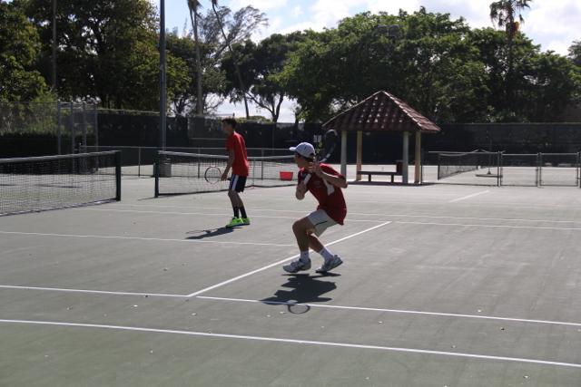 Gables starting their doubles match against Ferguson 