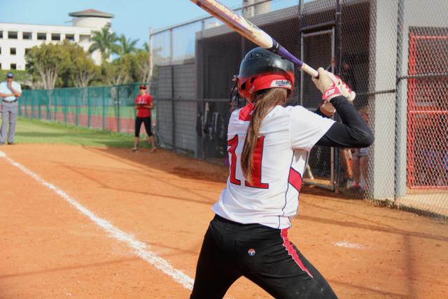 Number 11 winds up for a swing in the game against Ferguson.