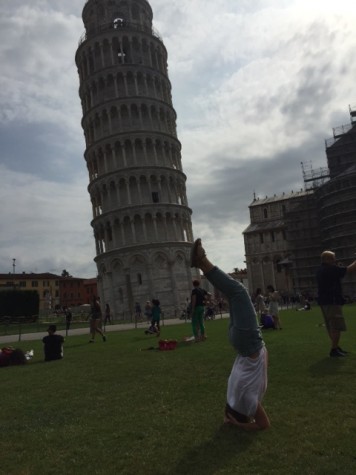 Senior Isabella Izquierdo gets fit as she does yoga next to the Leaning Tower of Pisa in Italy.