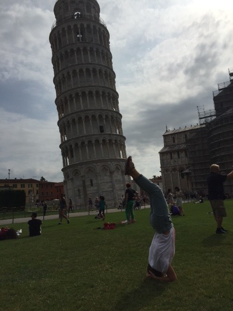 Senior Isabella Izquierdo gets fit as she does yoga  next to the Leaning Tower of Pisa in Italy.