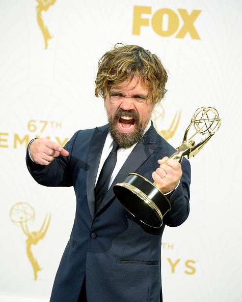 Peter Dinklage Of Game of Thrones posing with his Emmy.