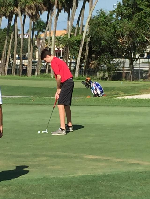 Max Rego looks to sink his putt.