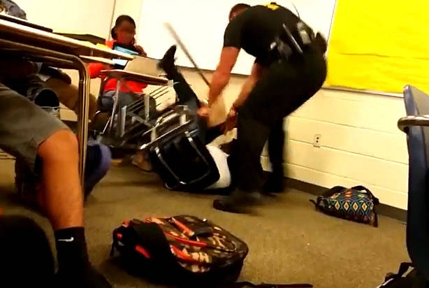 It's hard to believe that an officer would be so aggressive to a student sitting at her desk.