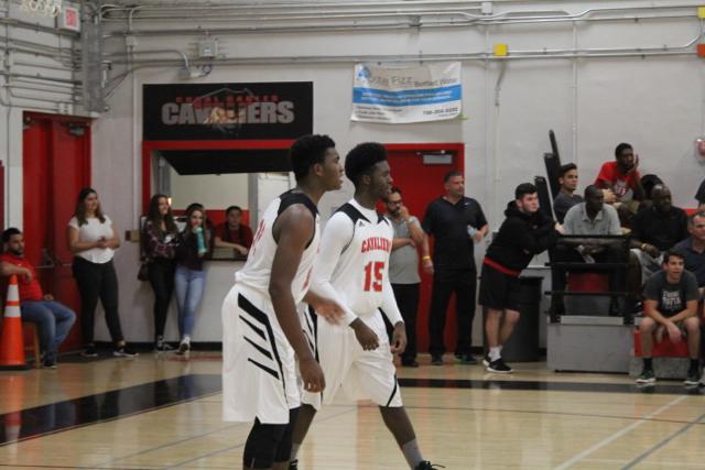 Cavs Beat Out Explorers in Varsity Basketball