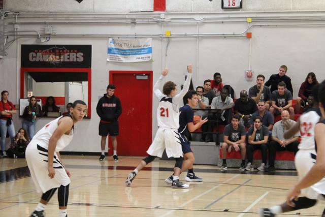 Cavs Beat Out Explorers in Varsity Basketball