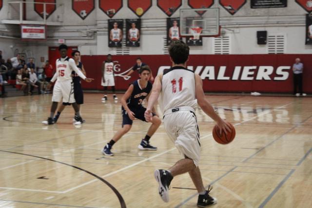 Cavs Beat Out Explorers in Varsity Basketball