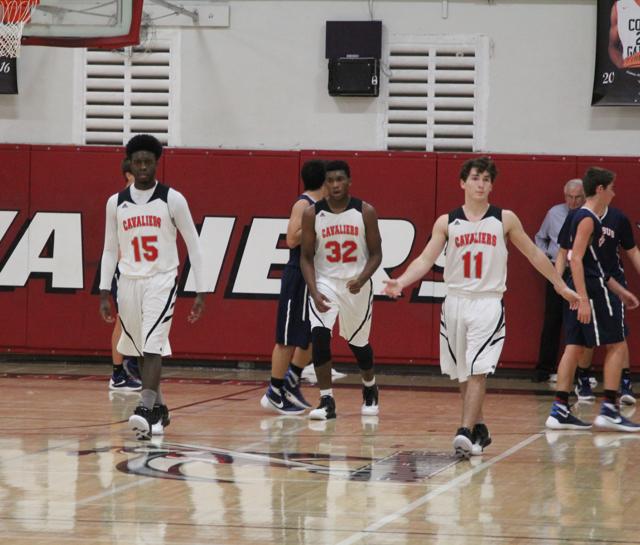 Cavs Beat Out Explorers in Varsity Basketball