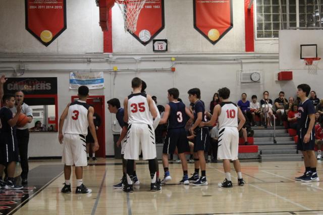 Cavs Beat Out Explorers in Varsity Basketball