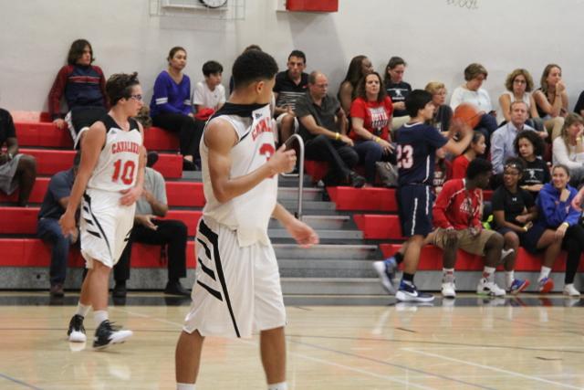 Cavs Beat Out Explorers in Varsity Basketball
